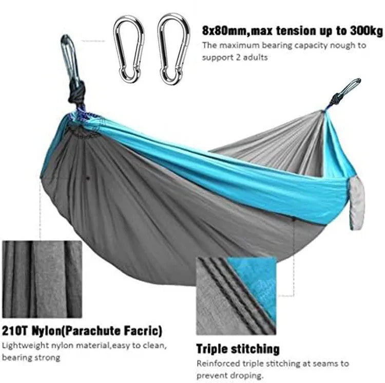 Blue nylon parachute cloth outdoor hammock hung between two trees showing full 270 cm length