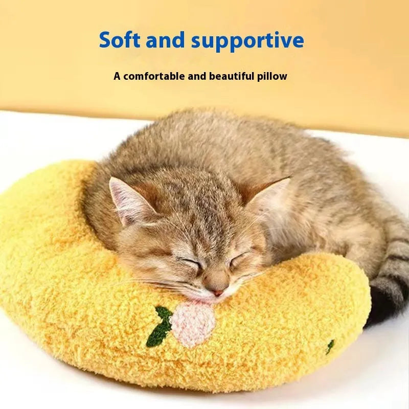 Blue U-shaped cat pillow with Moon design on a white background