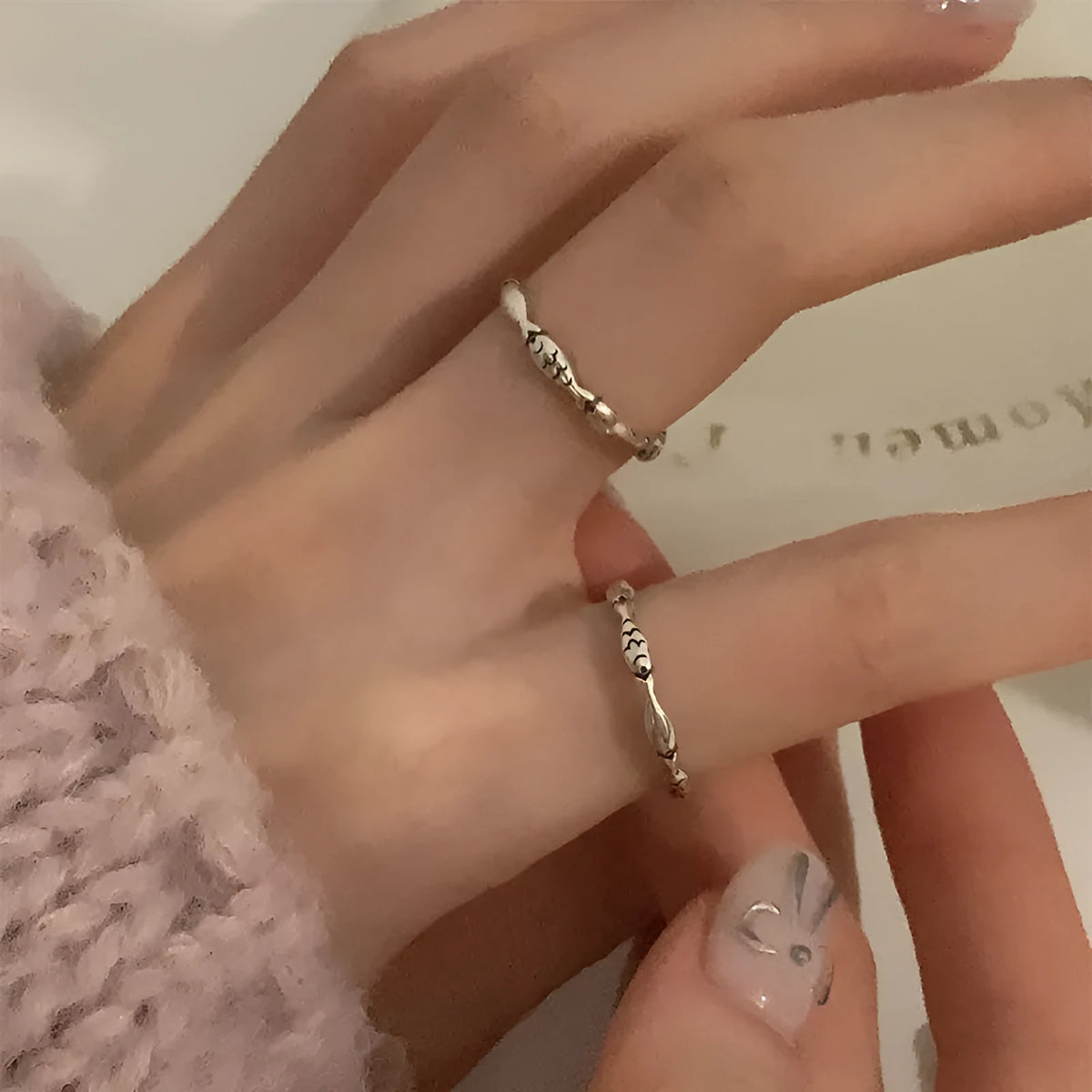 Women's adjustable copper fish ring in T020 white gold colour with electroplated finish and fish motif