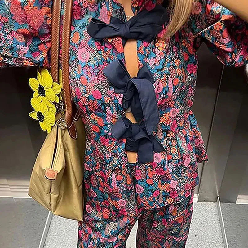 Women's floral print leisure suit set with tie-neck blouse and matching trousers