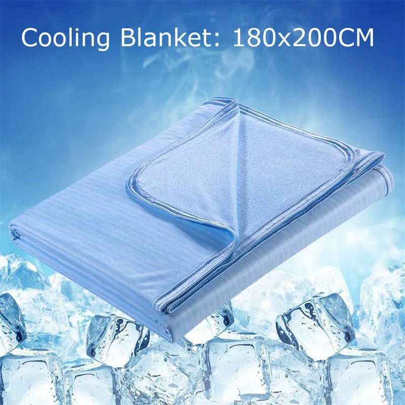 Blue cooling blanket with Japanese Q-Max fibres on a bed.