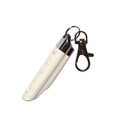 White remote control copy door key on surface