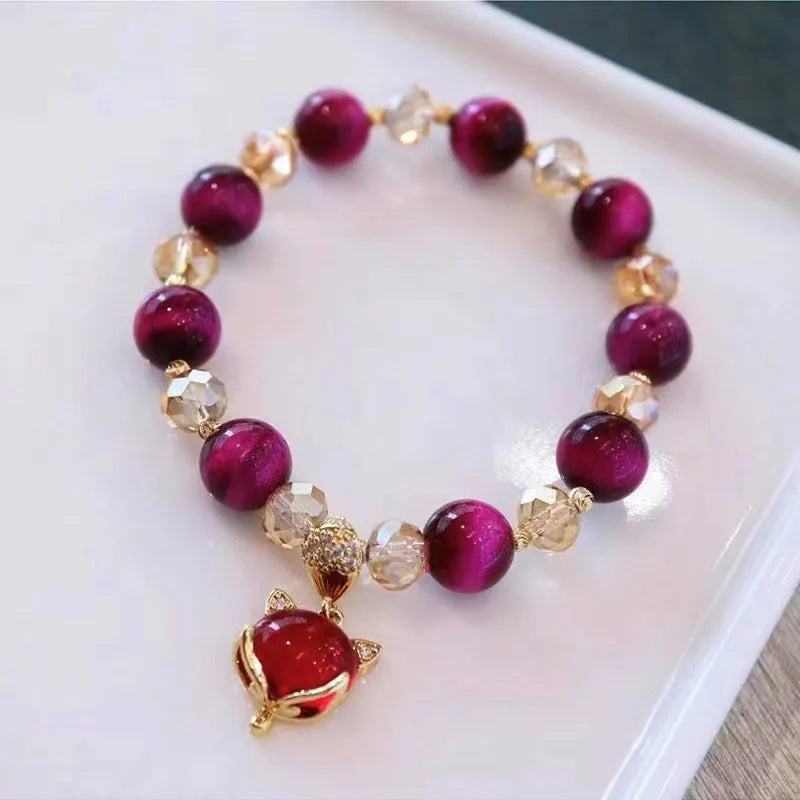 Handmade natural Tigereye stone bracelet with chain design and animal motifs