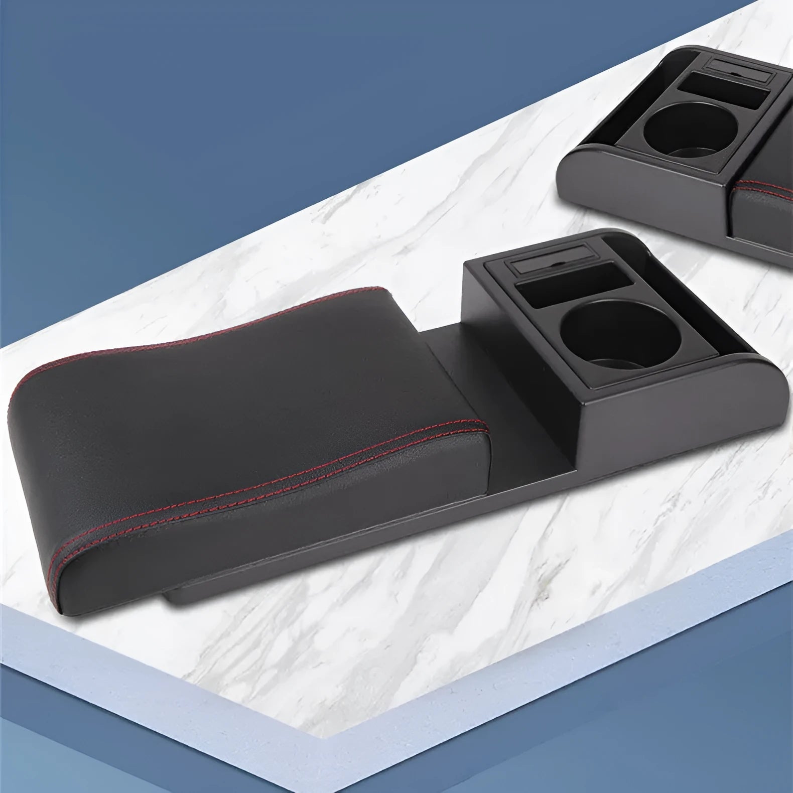 Universal car armrest cover in black with red decorative lines showing PU leather texture surface