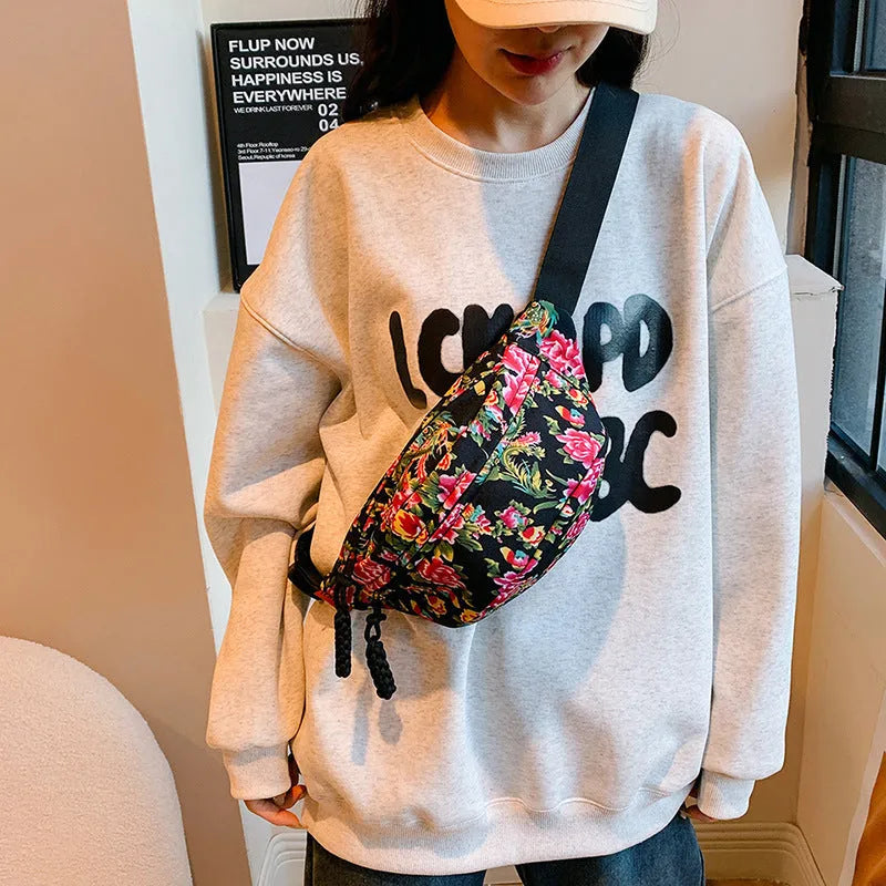 Women's western style waist bag with big flower decoration in black, red, green or blue colours