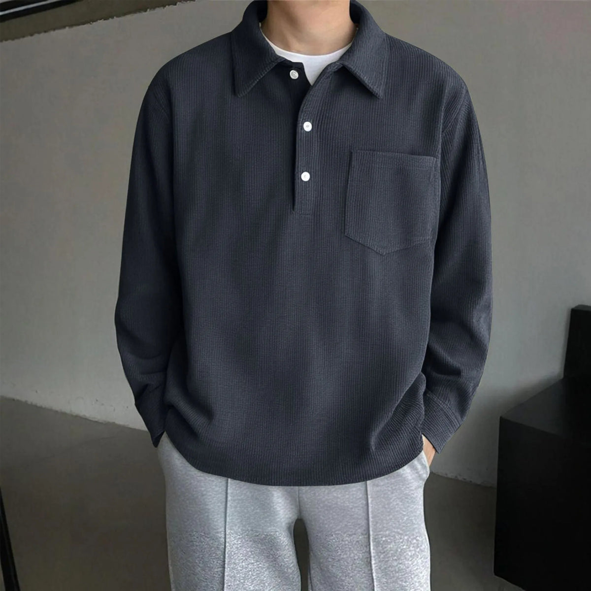 American retro casual bottoming shirt pullover in black, loose fit polyester fibre top on plain background.