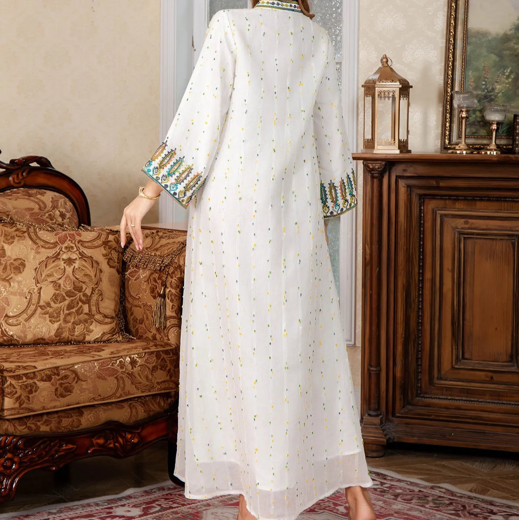 White polyester Arabic robe with long sleeves and full-length skirt on hanger