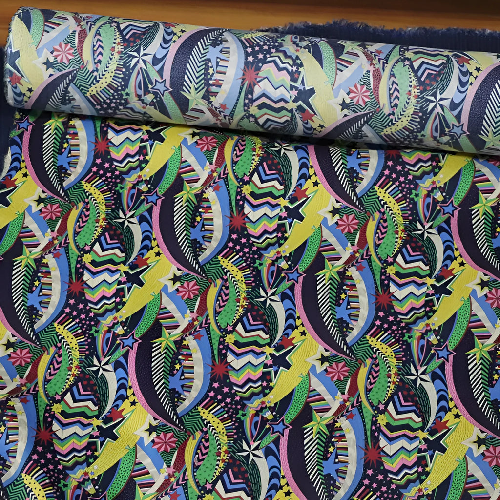 Blue floral printed cotton fabric on a roll showing plant and flower design, 145cm wide.