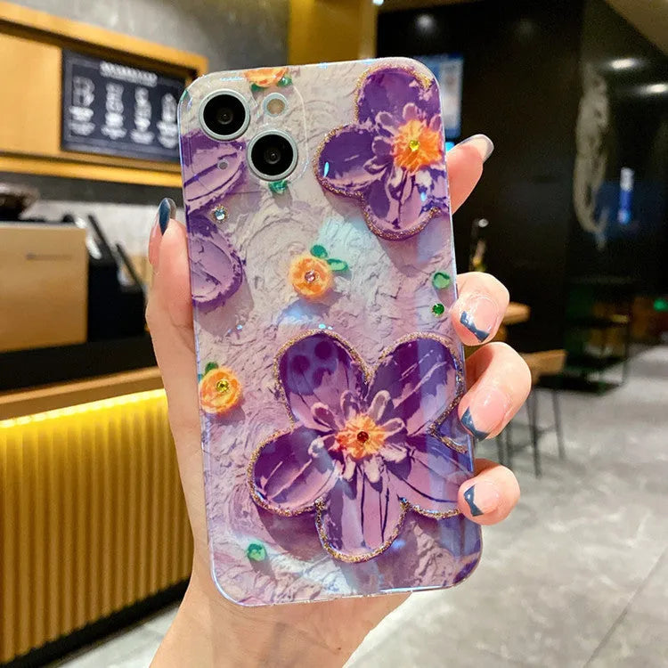 Soft rubber phone case with oil painting flower design and blue light effect featuring diamond drop glue detailing