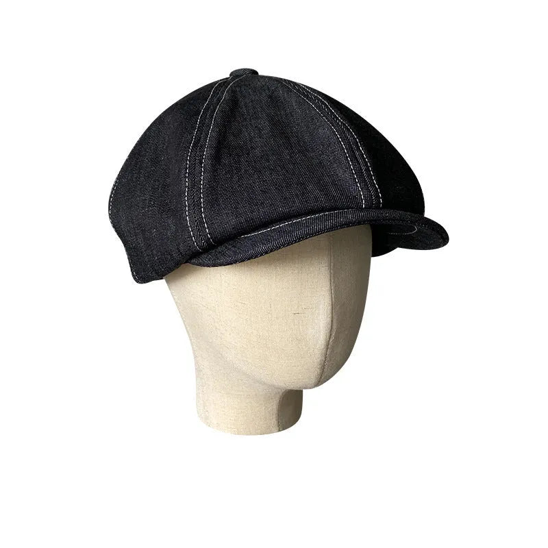 Black Japanese denim beret shown in unisex retro style with adult sizing options