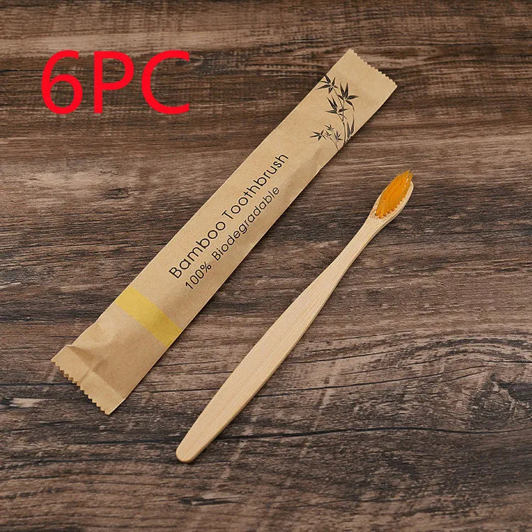 10 bamboo toothbrushes with coloured handles and charcoal bristles displayed together