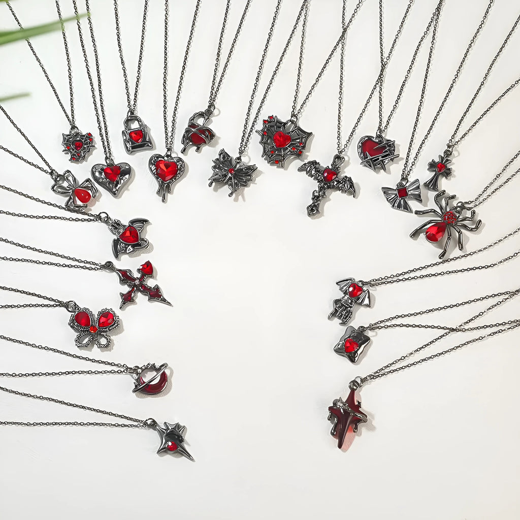 Gothic Halloween necklace with electroplated alloy pendant showing bat, spider, or cross design on a metal chain.