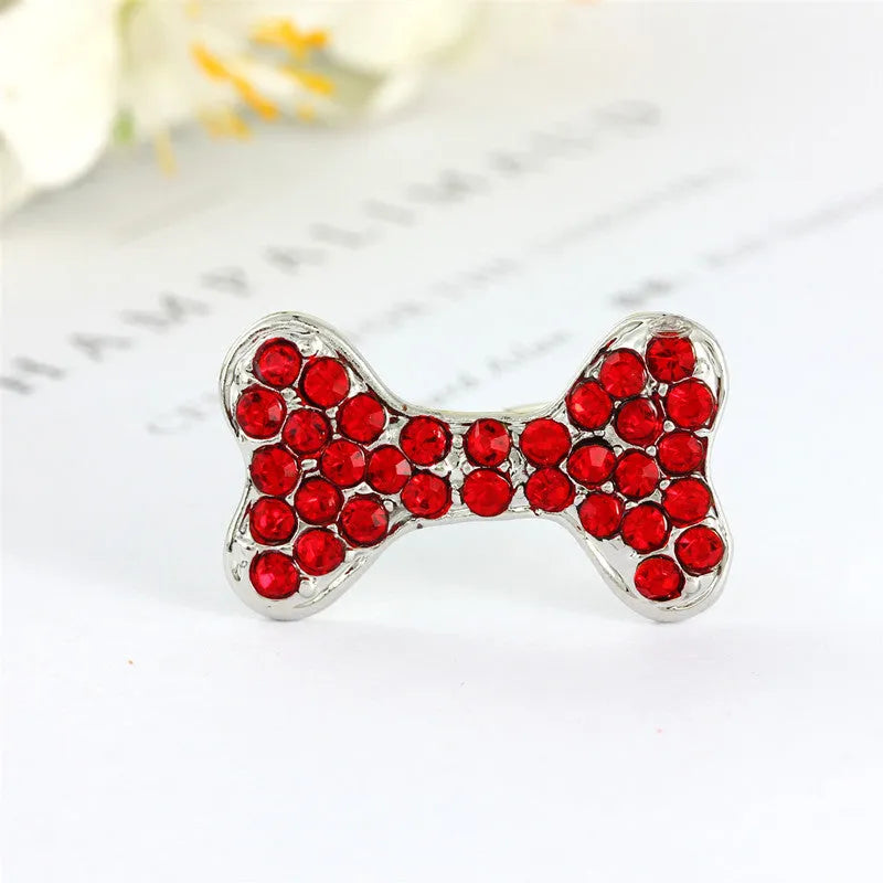 Rhinestone dog bone hair clip in alloy, shown in white, pink, blue, red and purple colour options.