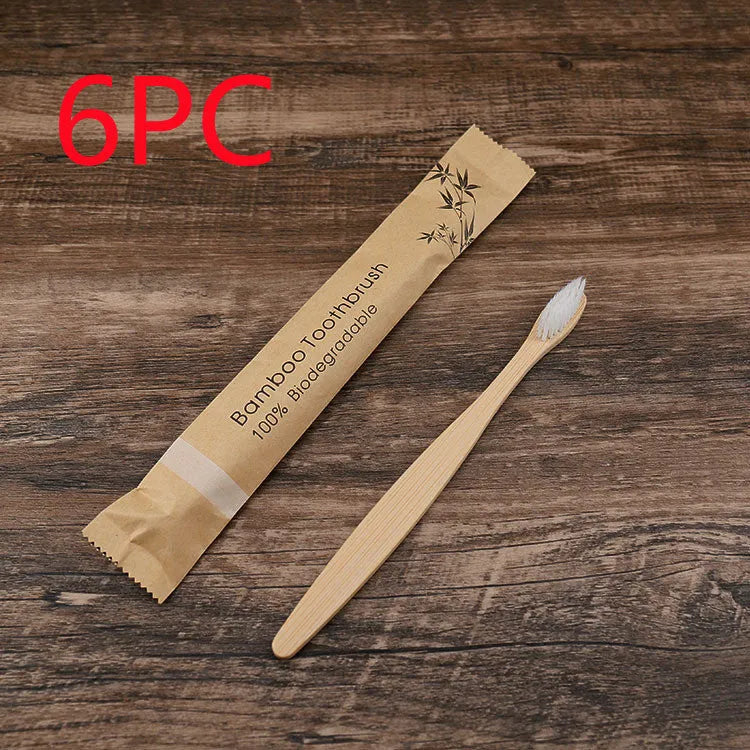 10 bamboo toothbrushes with coloured handles and charcoal bristles displayed together