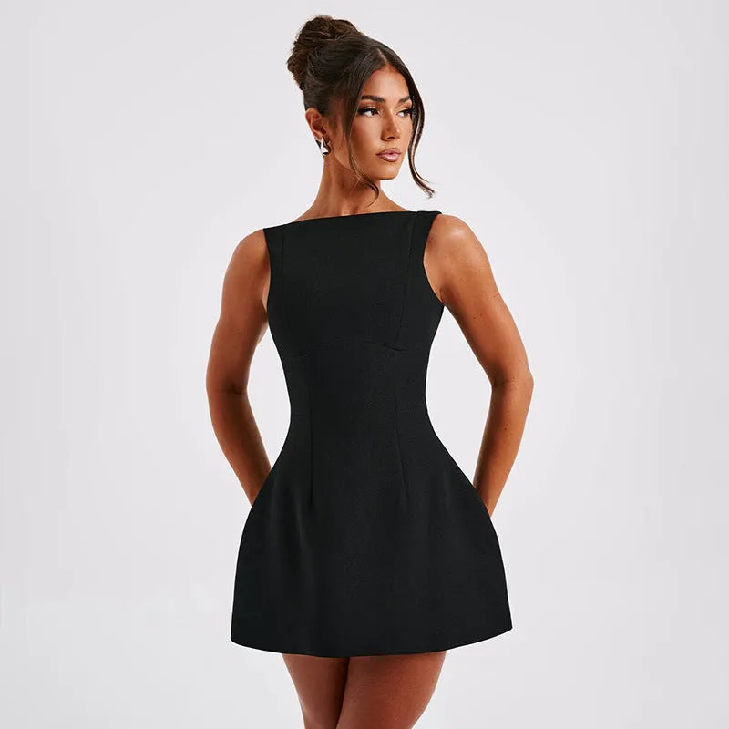 Slim-fitting black backless summer dress with sling-style straps and a high waist.