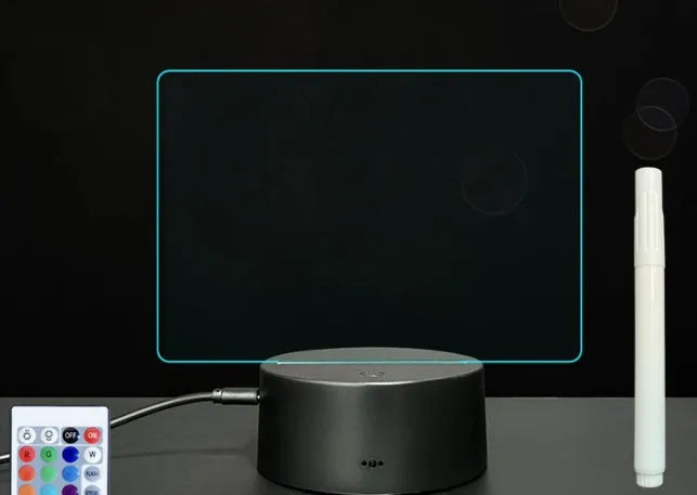 3D acrylic LED message board night light on a desk, showing illuminated surface and remote control