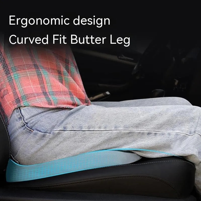 Curved bevel memory foam seat cushion for tailbone support in beige colour on a car seat.