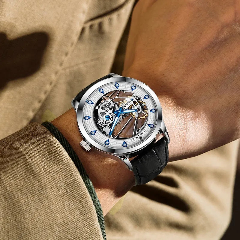 Men's silver case mechanical watch with white dial, blue hands, and black leather strap