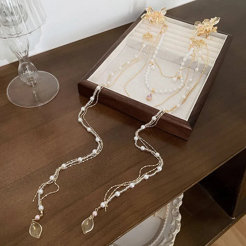 Women's gold hairpin with acrylic pearl diamond flower decoration and long tassel