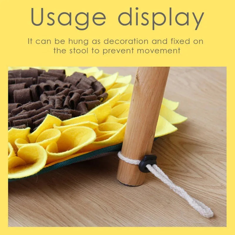 Yellow sunflower-shaped dog snuffle mat with rope and buckle for slow feeding and nosework training.