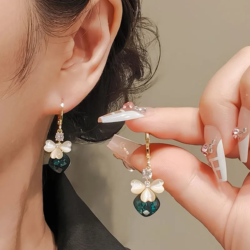 Electroplated blue crystal earrings with bow shape on alloy base