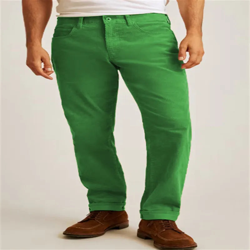 Loose fit solid colour corduroy casual trousers on a hanger showing straight leg and mid waist.