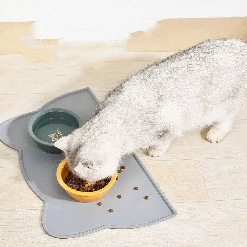 Silicone pet mat for cats and dogs with lock edge and anti-skid base, available in grey, blue and pink styles.