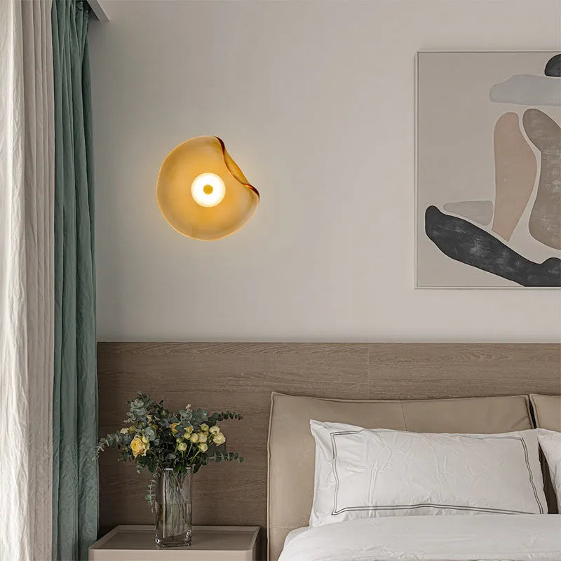 Round decorative wall lamp with glass shade in cognac colour for bedroom bedside lighting