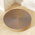 Green and white round cat scratching board with corrugated paper centre and raised nest edge.
