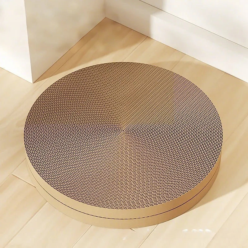 Green and white round cat scratching board with corrugated paper centre and raised nest edge.