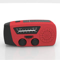 Red rechargeable emergency hand radio torch with USB port and wrist strap for disaster preparedness