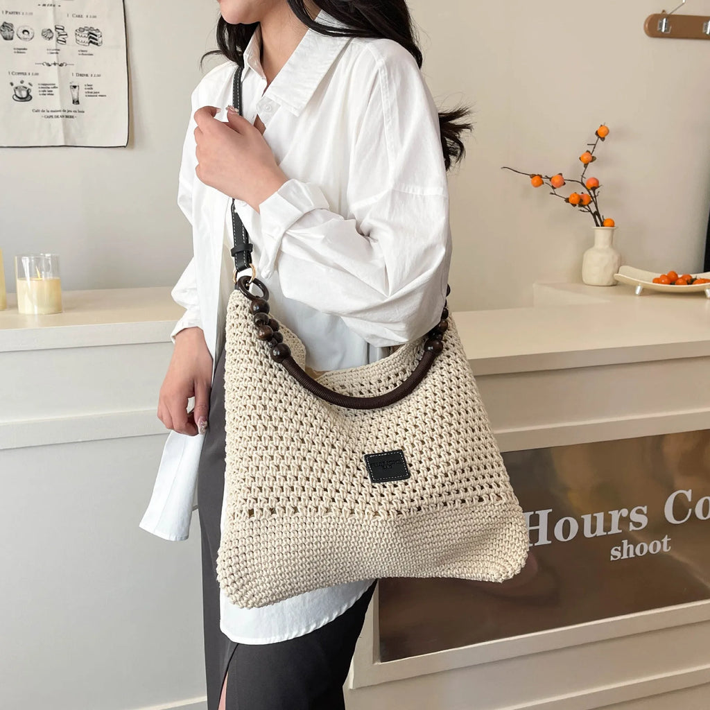 Large knitted beach tote bucket bag in black or brown with zipper compartment and contrasting stitching