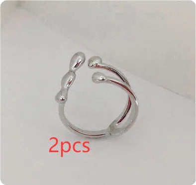Brass opening ring with spherical design in gold or silver colour for women