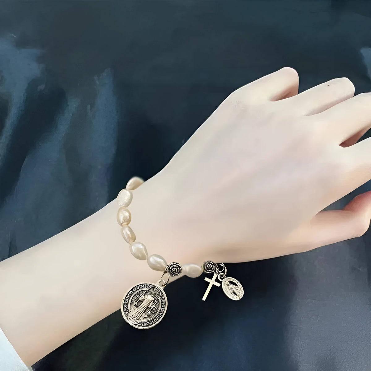Silver beaded flower bracelet on display with metal links