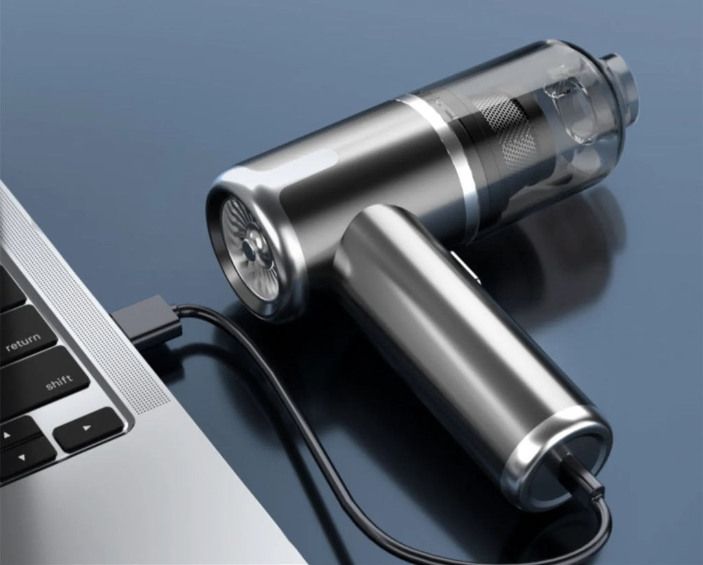 Dark grey handheld car vacuum cleaner with brush nozzle and Type-C charging cable