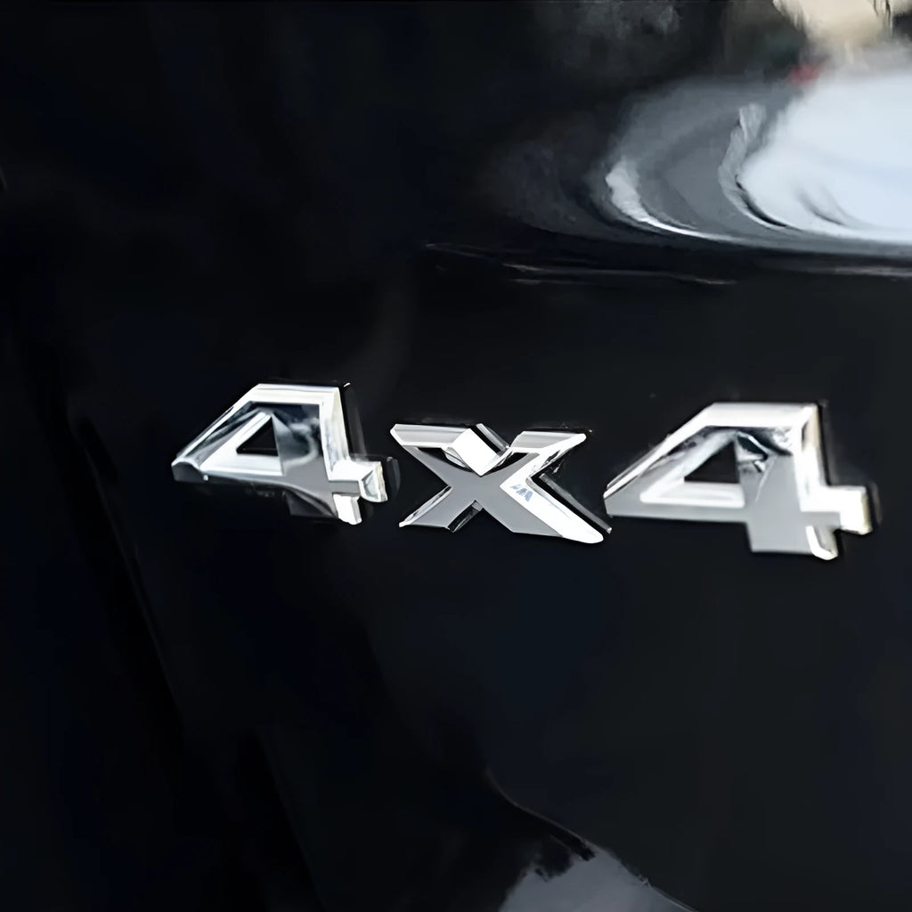 Metal 4x4 rear car badge in silver plated or black, 9cm x 3.5cm, for off-road vehicle use.