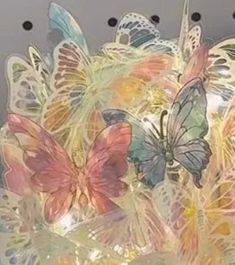 Butterfly night lamp with glass shade on raw wood base for bedroom ambience lighting