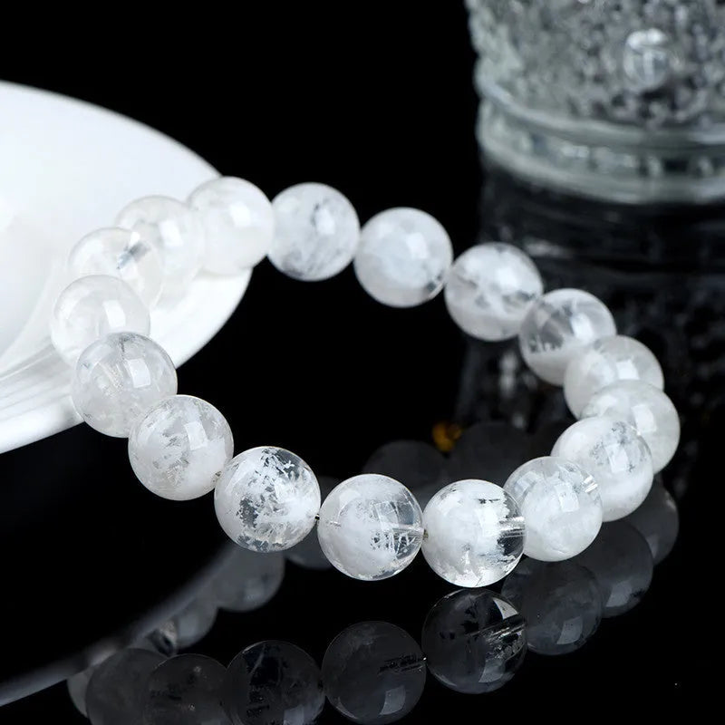 Women's crystal beaded bracelet with blizzard snowflake round beads and Ruyi Xiangyun design.