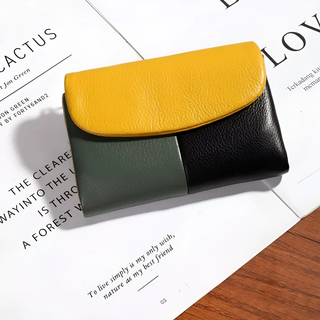 Women's short wallet with soft leather texture, solid colour design, stitching detail, and polyester lining, shown in one of nine colours.