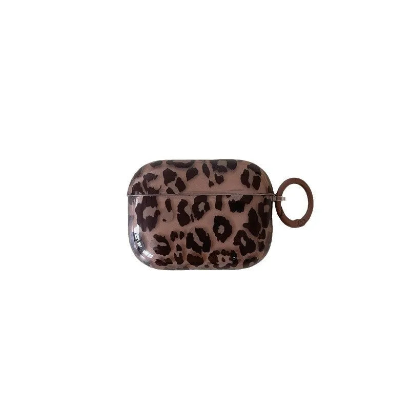 Transparent brown leopard printed PC earphone sleeve on Apple AirPods charging case showing visible logo and spotted pattern