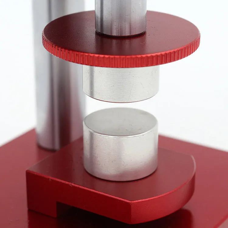 Watch repair spiral presser tool with a set of 20 plastic moulds for case backs on a grey surface