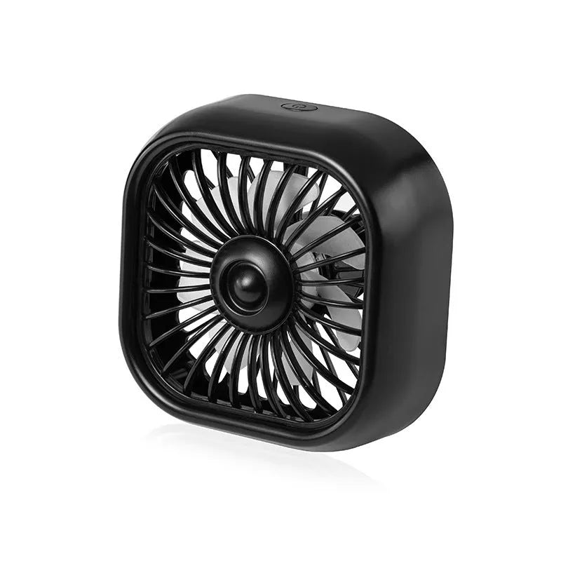 Small black USB electric fan with three speed buttons next to a charging cable