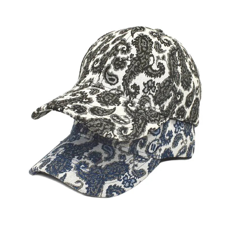 Blue polyester baseball cap with a white paisley pattern printed on the dome crown.