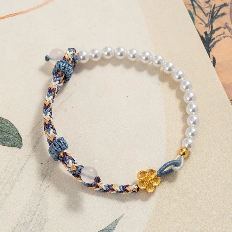 Peach-coloured cord bracelet with sterling silver Chinese flower weaving, chalcedony and pearl details.