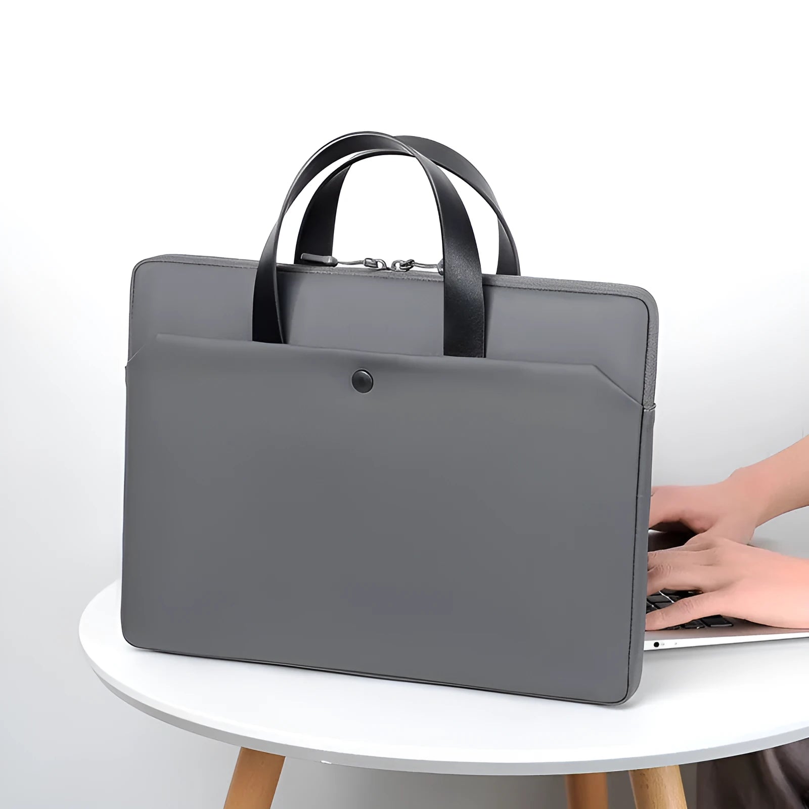 Ultra-thin leather laptop case in light gray with zipper closure and soft handle for 15.6-inch laptop