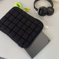 Large capacity laptop bag in black or white with durable nylon exterior and cloud cotton interior