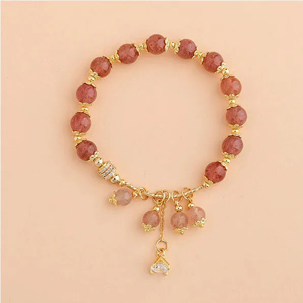 Pink strawberry quartz crystal bracelet with heart shapes and pearl accents for women