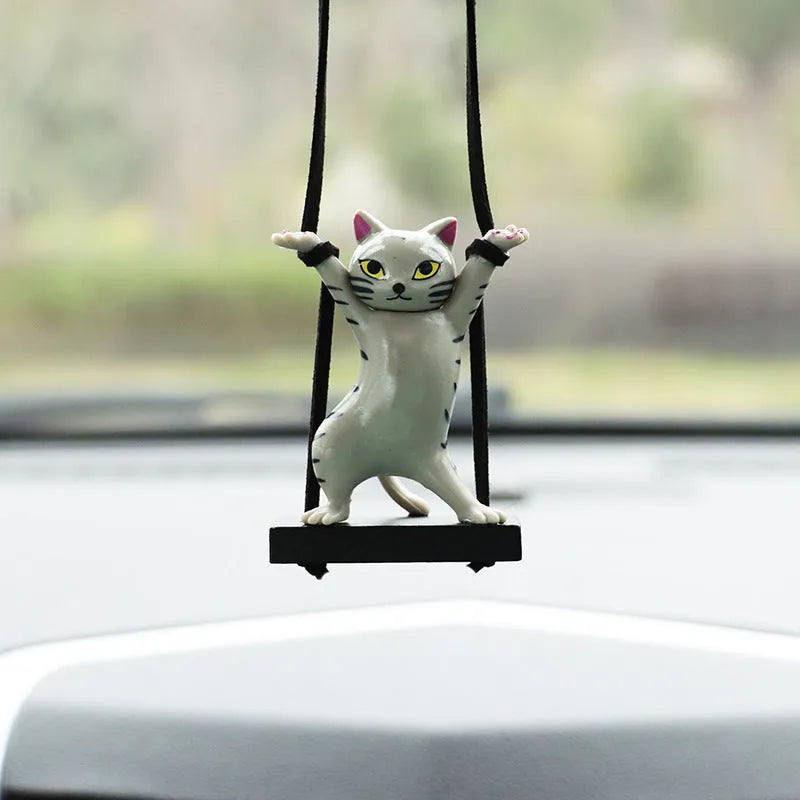 Resin cartoon cat pendant for car interior decoration with adjustable rope, shown in multiple colour options.