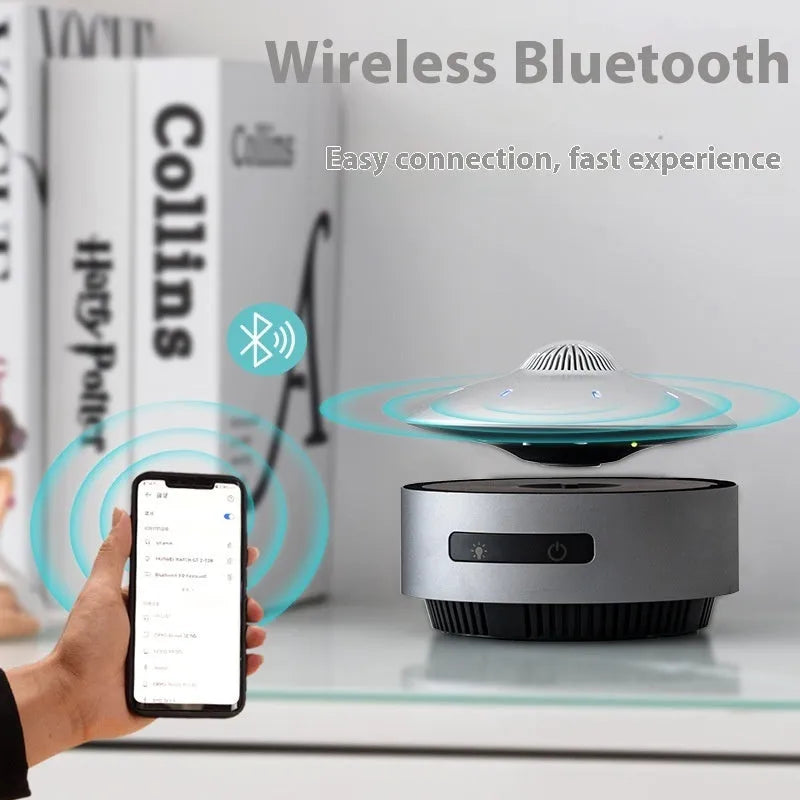Automatic lifting magnetic levitation Bluetooth speaker floating above its base