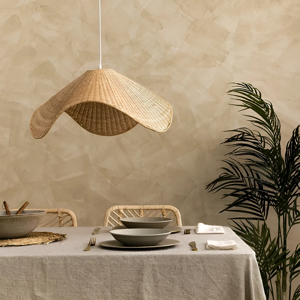 Handmade natural rattan and willow bamboo chandelier with warm LED light in a rustic setting.